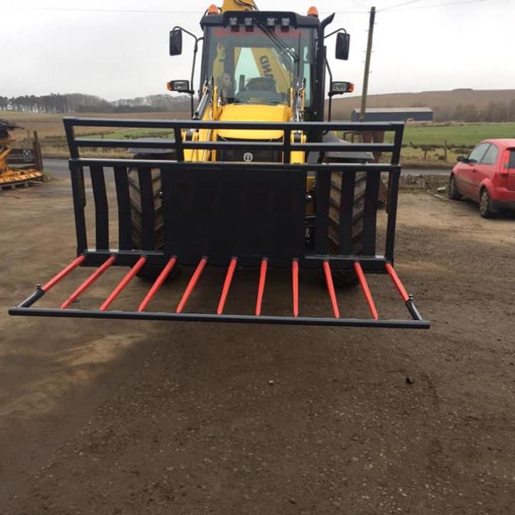 8ft wide Muck Fork with filled in middle, top greedy board and road safe bar