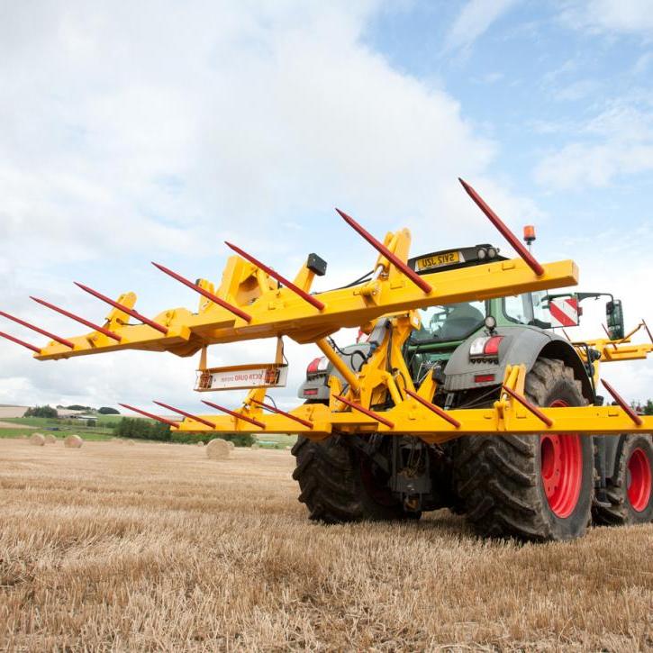 cta-Quad Bale Handling System - front and rear sections for carrying 12 round bales or 6 Heston bales at a time. Showing the hydraulic folding version.